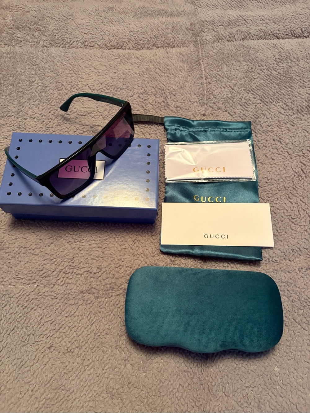 Gucci Teal Frame Sunglasses with Purple Lenses